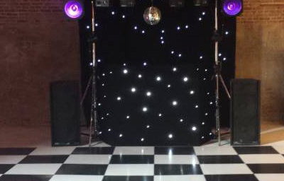 Black Gold Rig with mirrorball, Starcloth backdrop and uplighters (daylight)