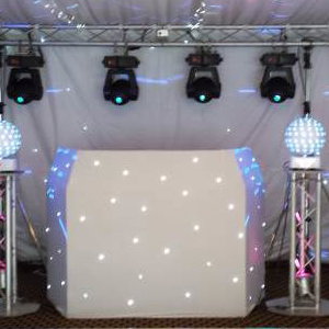 Large white hi-tech rig with TVs