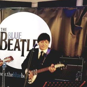 The Blue Beatles Duo performing in black Chesterfield suits