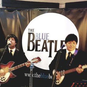 The Blue Beatles Duo performing in black Chesterfield suits