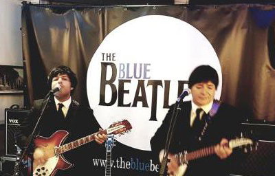 The Blue Beatles Duo performing in black Chesterfield suits