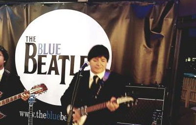 The Blue Beatles Duo performing in black Chesterfield suits