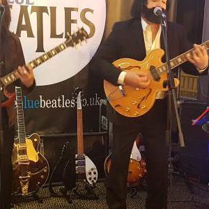 The Blue Beatles Duo performing in late era costumes