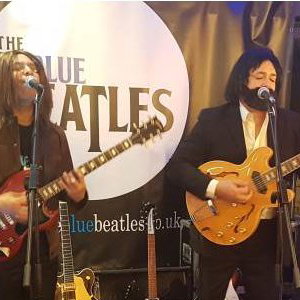 The Blue Beatles Duo performing in late era costumes