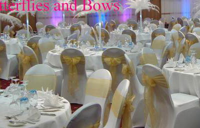 Full Set Up With Postrich Centres, Uplighters, Chair Covers Etc