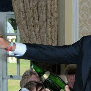 The Groom Takes Charge of the 'Sabrage'