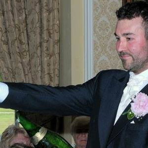 The Groom Takes Charge of the 'Sabrage'