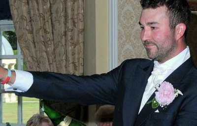 The Groom Takes Charge of the 'Sabrage'