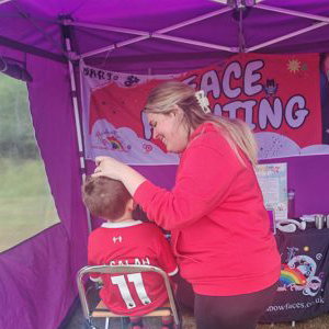 Rainbow Faces Ltd staff in action, face painter