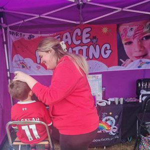 Rainbow Faces Ltd staff in action, face painter