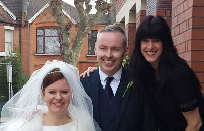 A photo with the bride and groom after the service