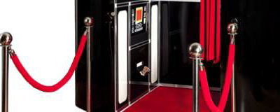 black photobooth with red carpet