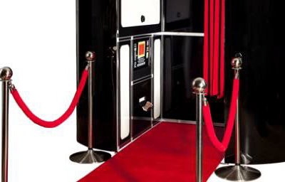black photobooth with red carpet