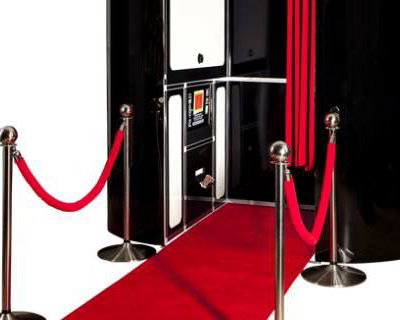 black photobooth with red carpet