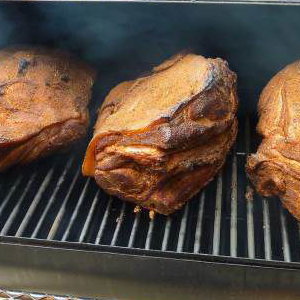 Smoking our pork shoulder the authentic way - 10 hours over oak - makes perfect pulled pork