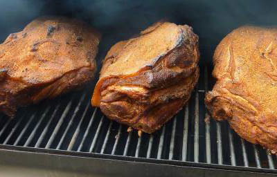Smoking our pork shoulder the authentic way - 10 hours over oak - makes perfect pulled pork