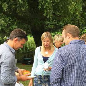 Queue for truck at farmhouse summer party