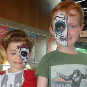 Face paint + glitter tattoos = happy boys!