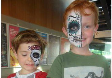 Face paint + glitter tattoos = happy boys!