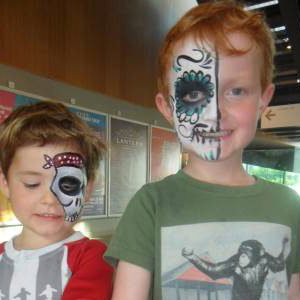 Face paint + glitter tattoos = happy boys!