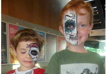 Face paint + glitter tattoos = happy boys!