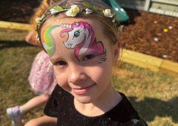 Unicorn face painting by Faces by Sandra 