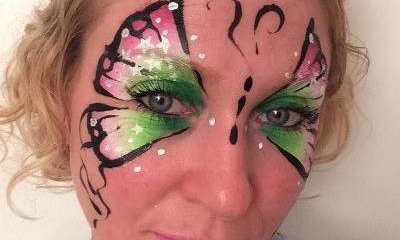 Painted Peacock Face Painting and Glitter Art