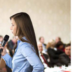 graphicstock-beautiful-business-woman-is-speaking-on-conference_BR74d1sbb