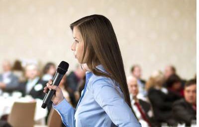 graphicstock-beautiful-business-woman-is-speaking-on-conference_BR74d1sbb