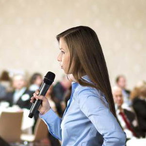 graphicstock-beautiful-business-woman-is-speaking-on-conference_BR74d1sbb
