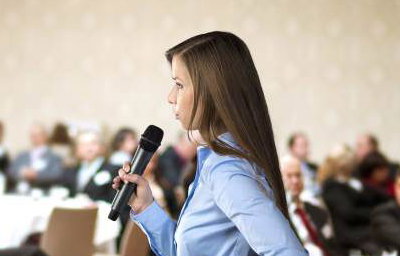 graphicstock-beautiful-business-woman-is-speaking-on-conference_BR74d1sbb