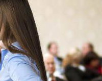 graphicstock-beautiful-business-woman-is-speaking-on-conference_BR74d1sbb