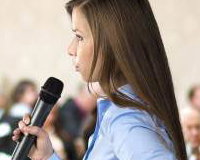 graphicstock-beautiful-business-woman-is-speaking-on-conference_BR74d1sbb