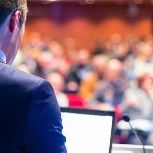 bigstock-Speaker-at-Business-Conference-64962394
