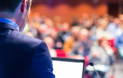bigstock-Speaker-at-Business-Conference-64962394