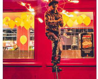 Fire-Umbrella-Unicyclist--at-Pepes-Piri-Piri-Paisley