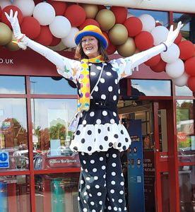 Stiltwalker Candy Clown refreshing the Matalan store Glenrothes.jpg
