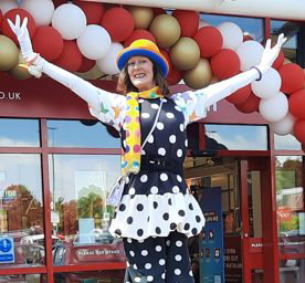 Stiltwalker Candy Clown refreshing the Matalan store Glenrothes.jpg