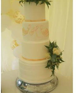 Elegant 4 tier wedding cake by a Cambridge cake designer 