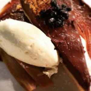 salted chocolate tart with clotted cream and hazelnut granola 