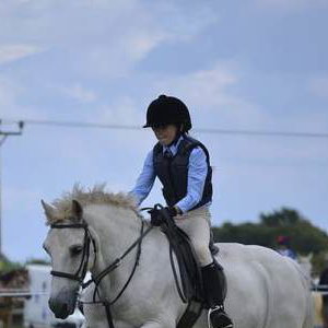 white-horse-jumping-child-white