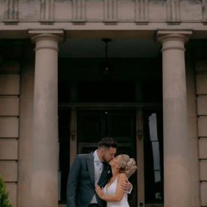 Bride and Groom kissing outdoors