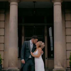 Bride and Groom kissing outdoors