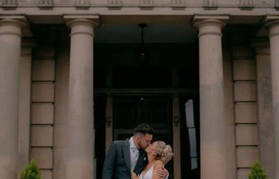 Bride and Groom kissing outdoors
