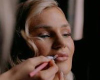 Bride having makeup applied during Bridal Preparations