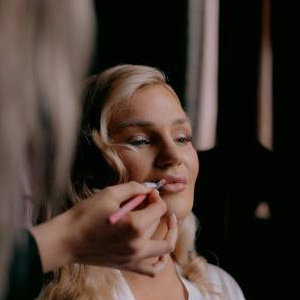 Bride having makeup applied during Bridal Preparations