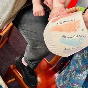 Painting footprints onto a hanging planter