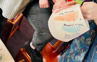 Painting footprints onto a hanging planter