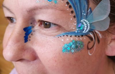 Adult facepaint with handmade bling