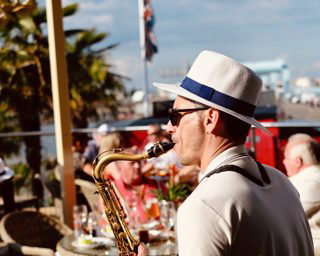 Saxophonist rooftop party